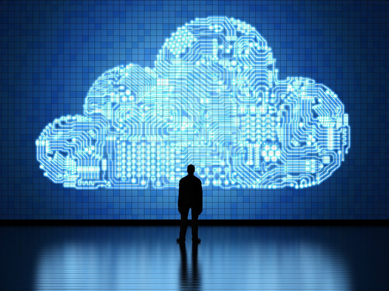 Silhouette of a person standing in front of a large digital cloud icon made of circuit patterns on a blue tiled wall. The scene suggests themes of technology, data, and cloud computing.